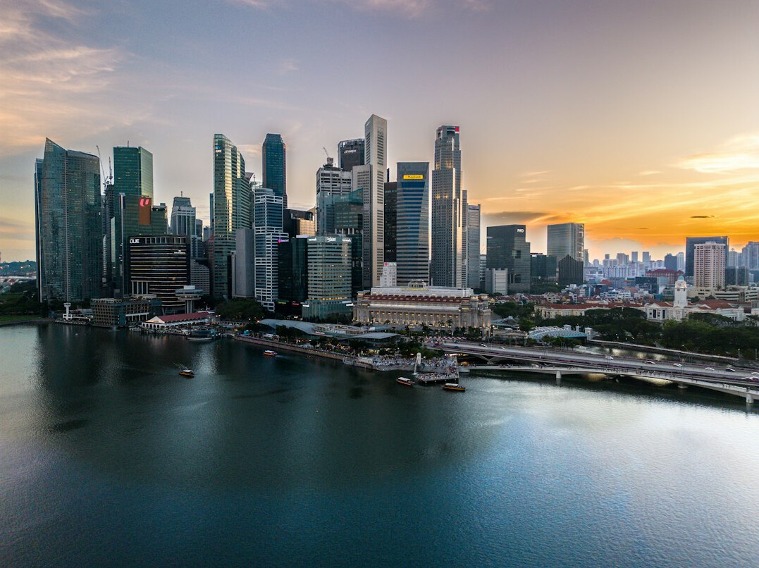 Rental car driving past the Singapore skyline at dusk