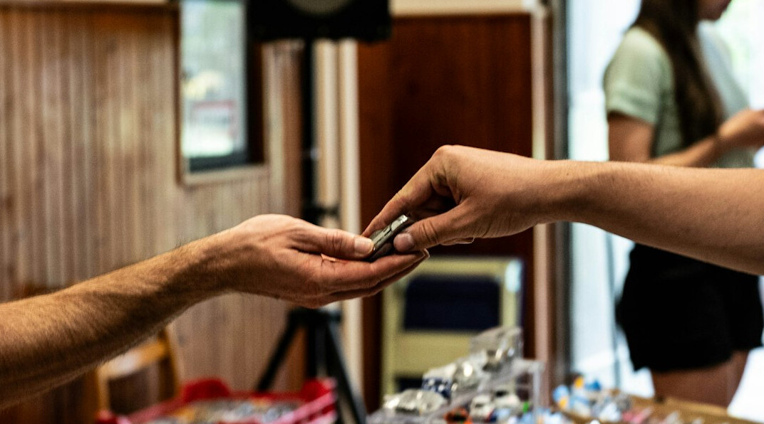 Customer receiving car keys from a rental agent