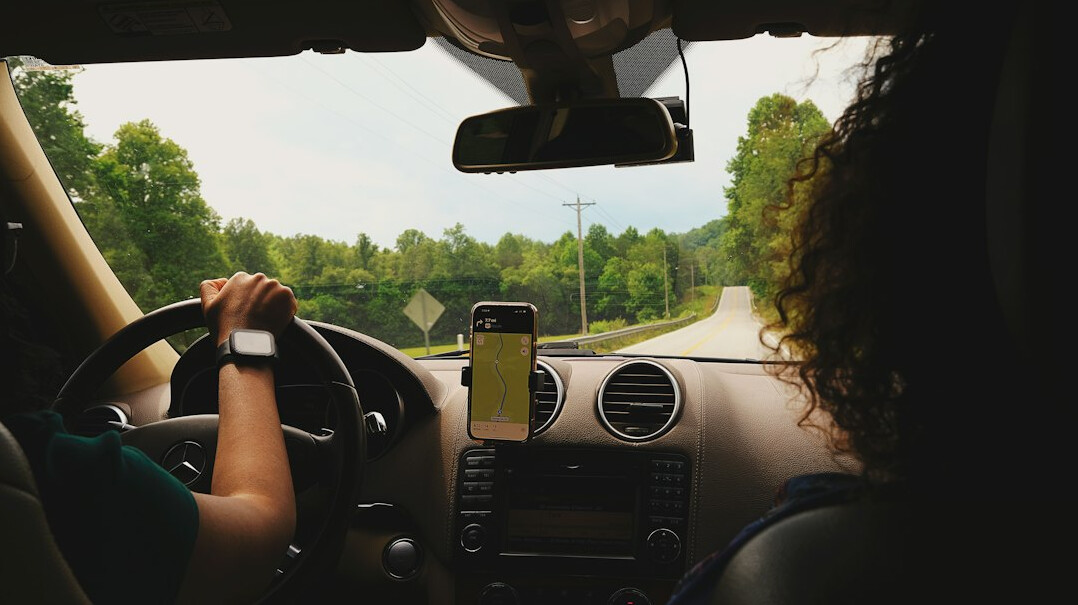 driver using rental car navigation
